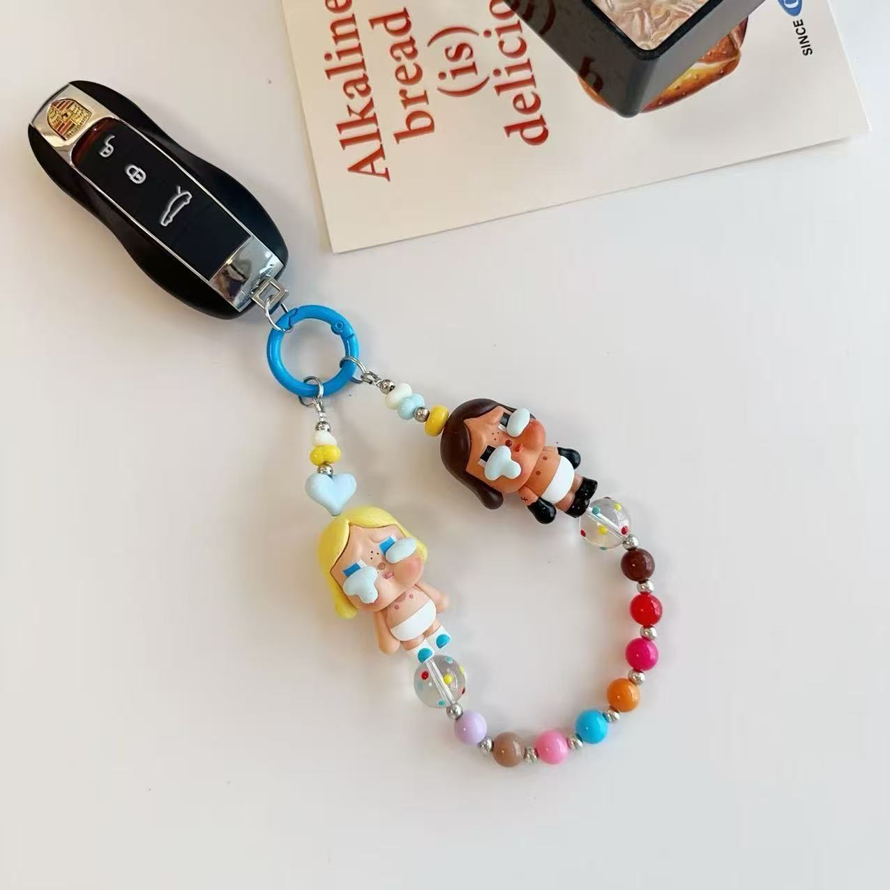 New cute cartoon crying baby candy color resin beaded lanyard mobile phone chain