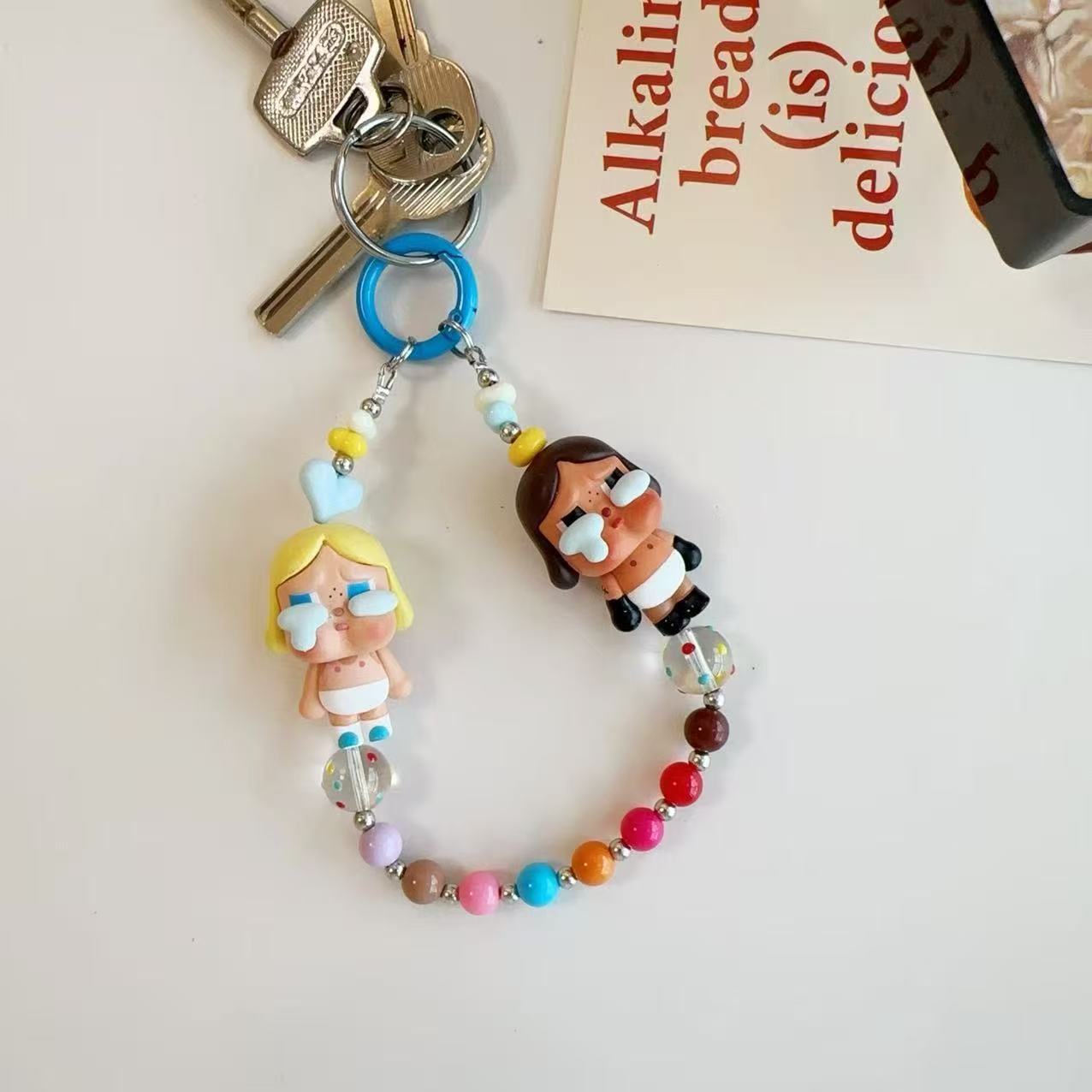 New cute cartoon crying baby candy color resin beaded lanyard mobile phone chain